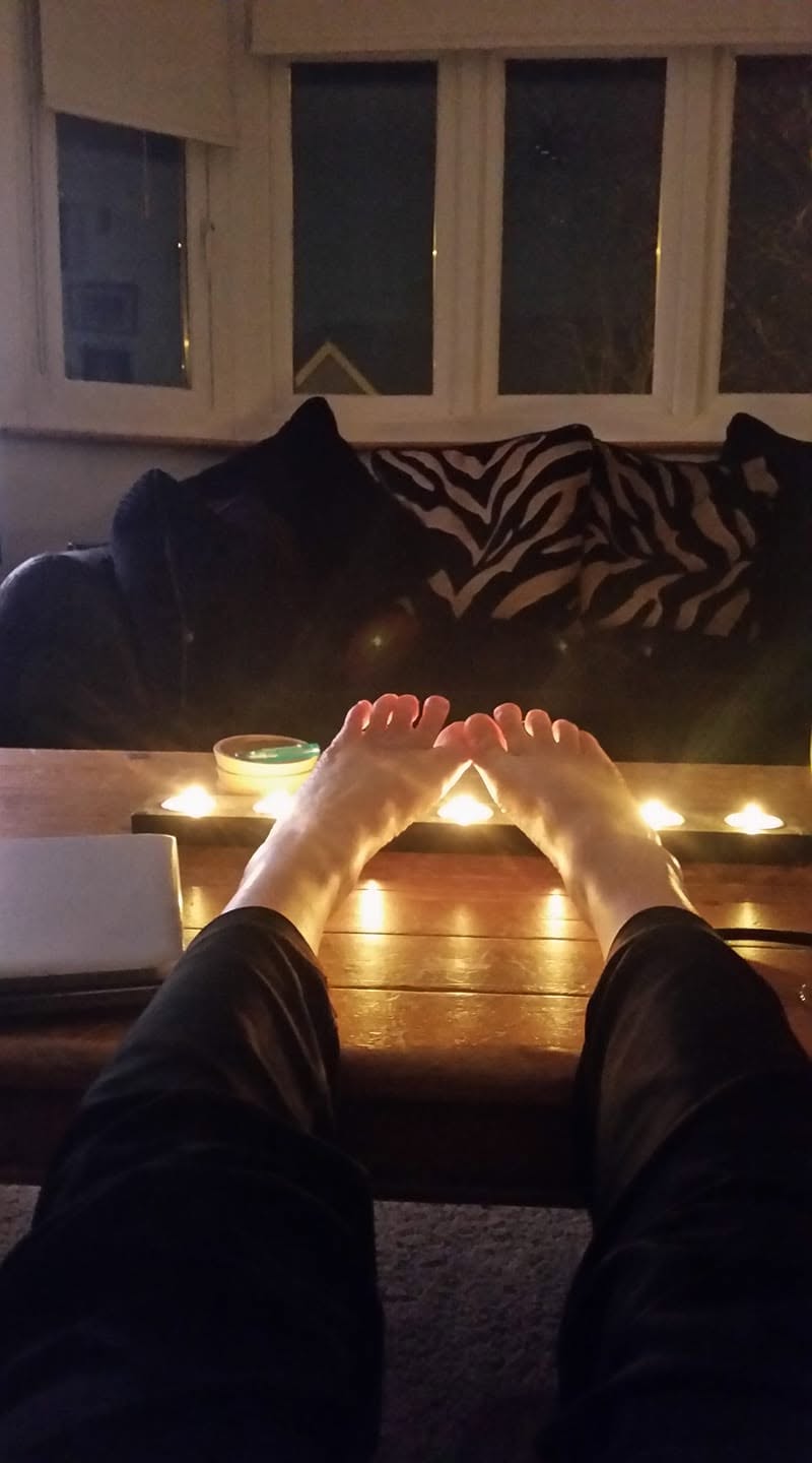 Warming by a candlelit arrangement indoors